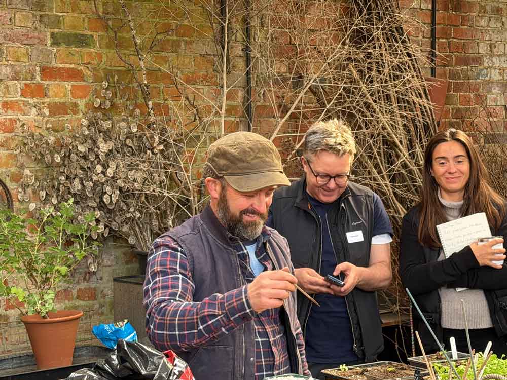 Ben Pope explaining ‘Pricking out’ with the Good Gardening Students