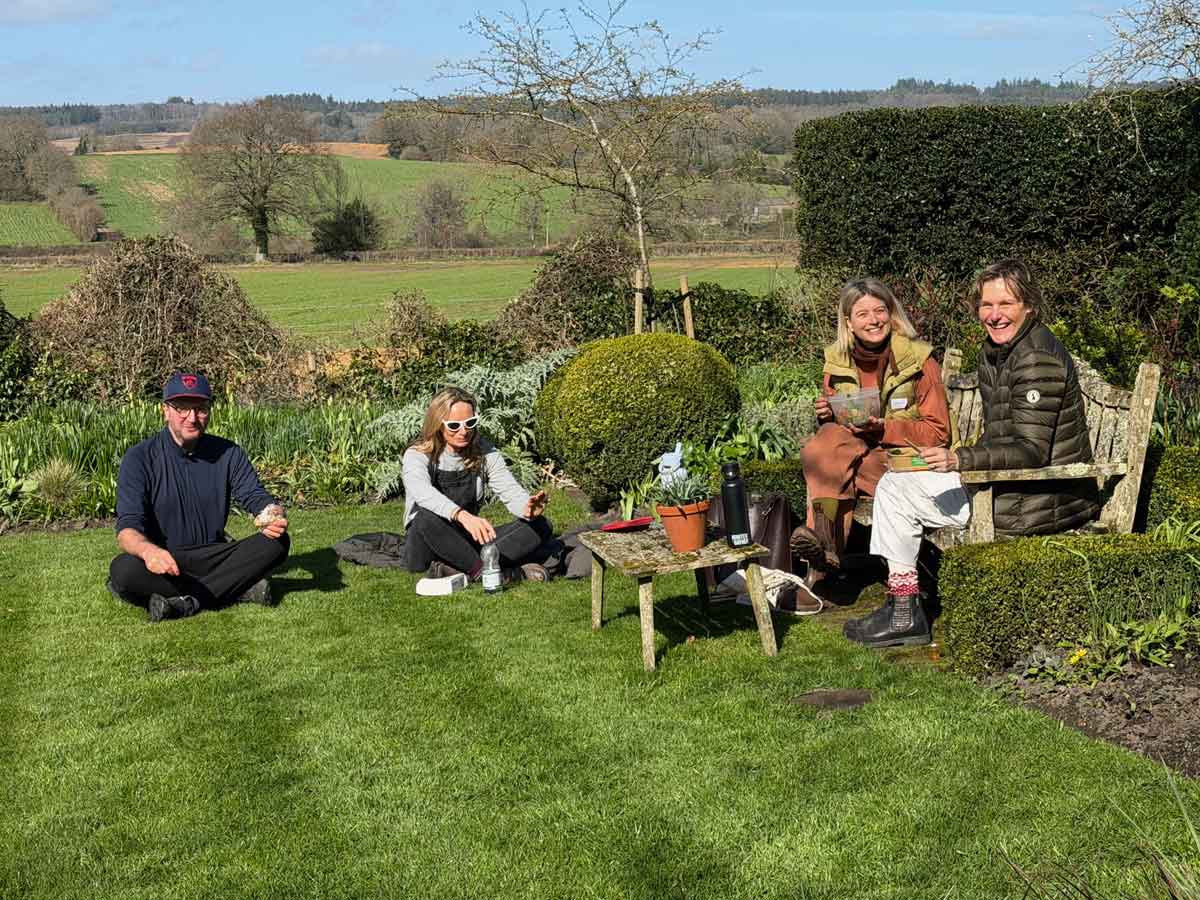 Good Gardening Students enjoying a picnic lunch in the March sunshine